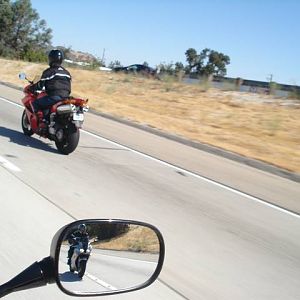 Casey making a pass, Bob behide in the mirror