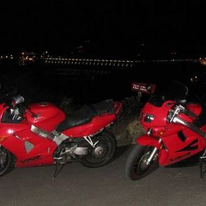 bikes with dam at night in the dalles