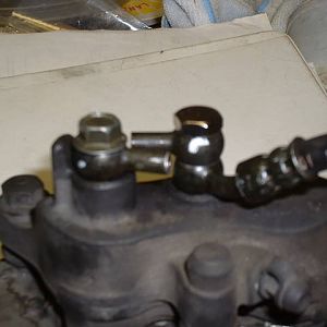 REar brake caliper on bench